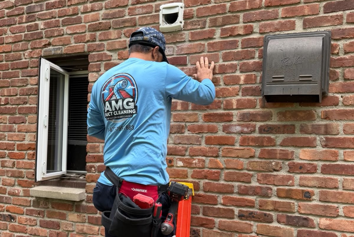 AMG Duct Cleaning technician servicing air ducts in a New Jersey home